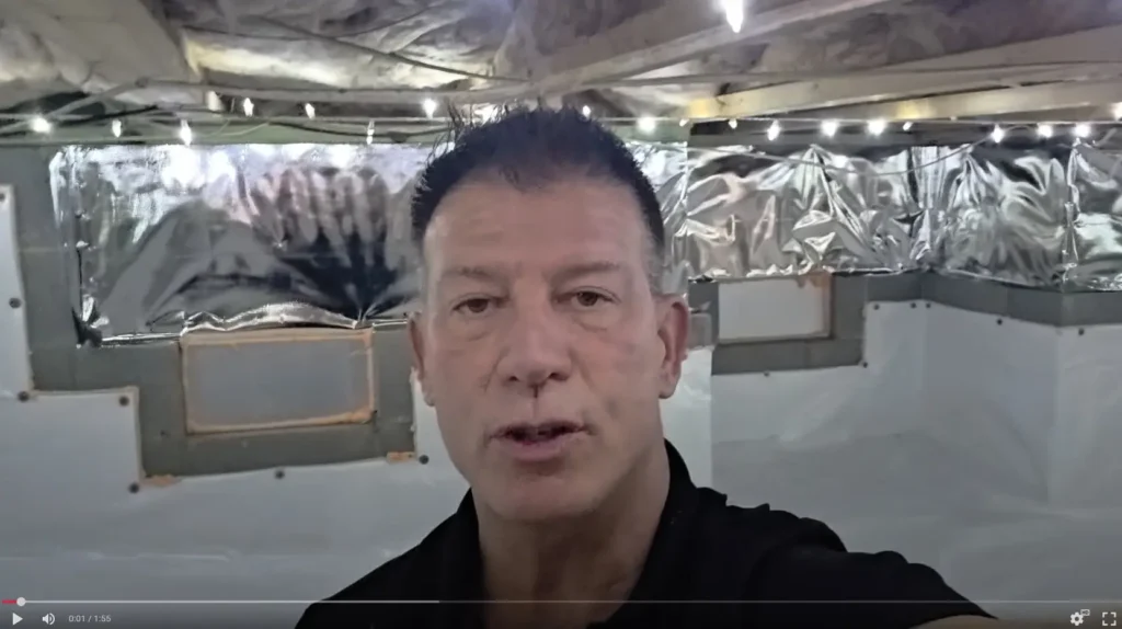 Picture of a video with owner of sealed solution presenting a finished beautiful clean, brightly lit and healthy sealed crawl space.